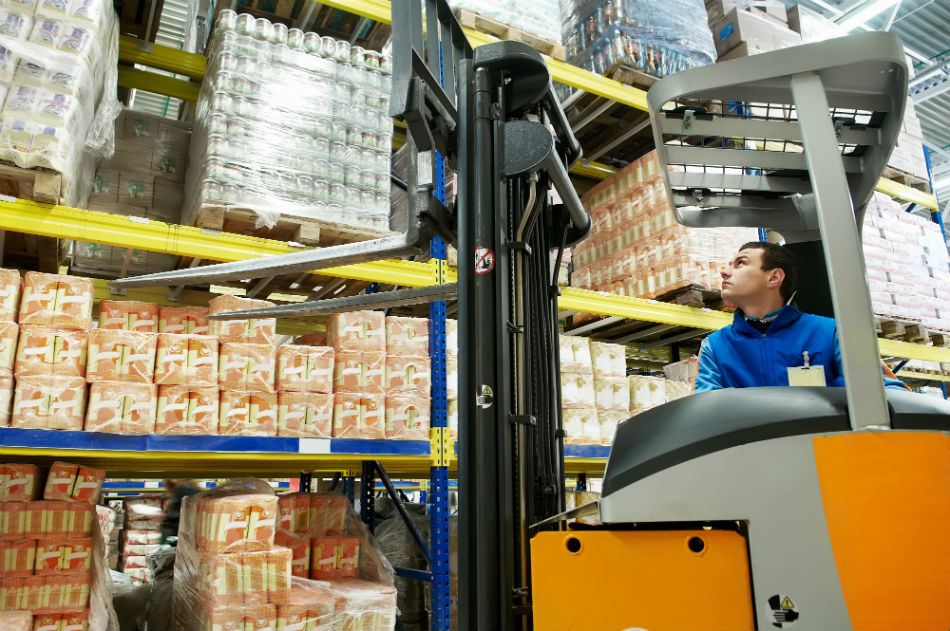 Forklift operator in warehouse