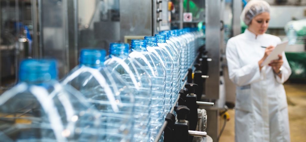 Women performing quality audit at food manufacturing facility